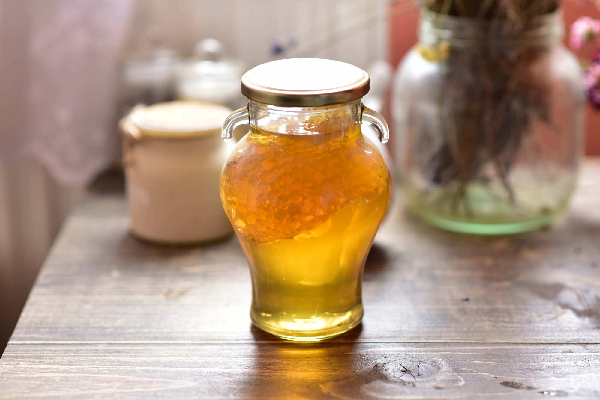 Honey with honeycomb in a jar